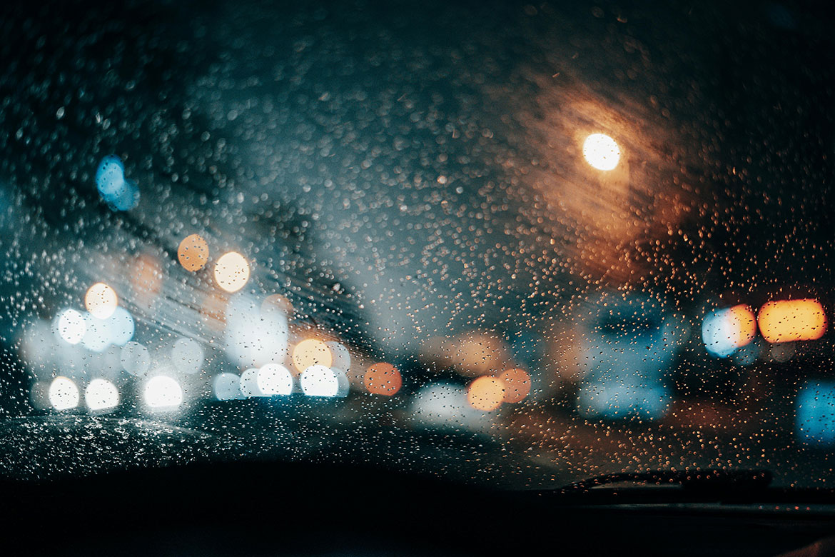 Car headlights shining brightly in dark or dim conditions